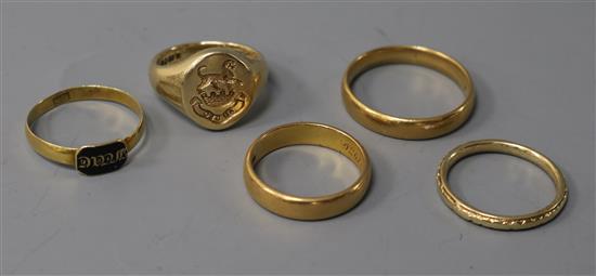 Five assorted rings including three wedding bands 22ct(2) & 9ct(1), a 9ct signet ring and a 19th century yellow metal mourning ring.